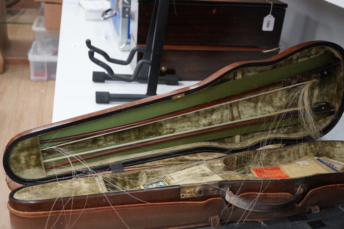 A late 19th century German violin in a Hill & Son oak case, with Hill canvas slip cover, together with an unbranded silver mounted bow, and another, ivory submission ref: 9HJU3B45 and ZC2E1GCP